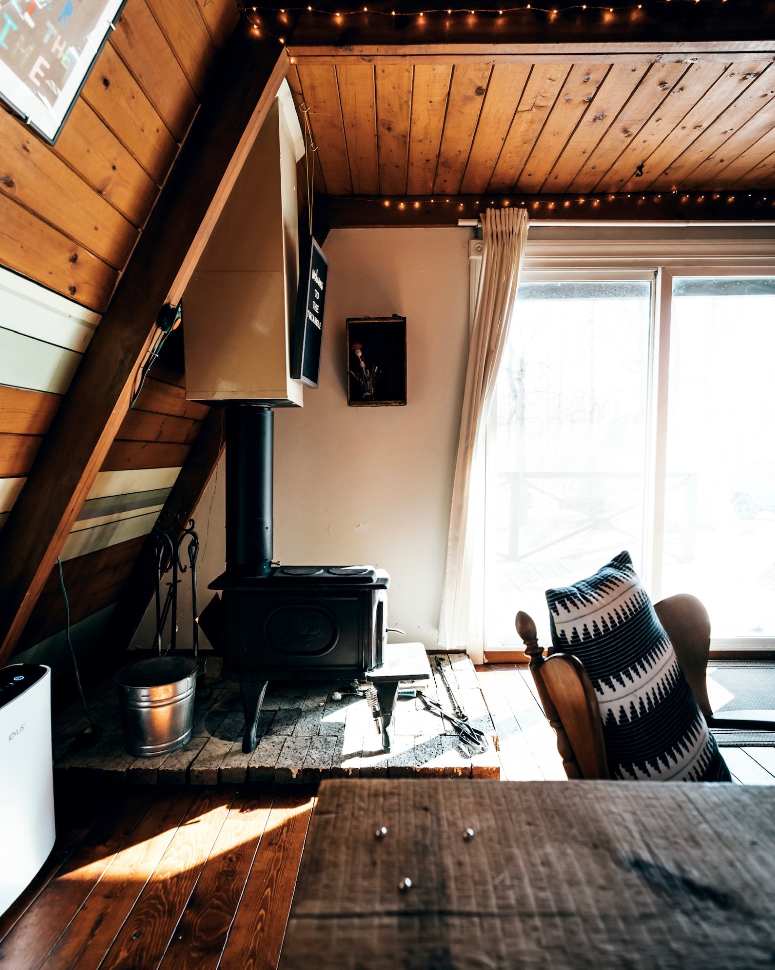 Cast iron wood-burning stove inside The Triangle cabin